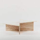 Triangular travertine coffee table